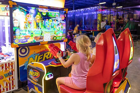 ElliePlayingNerfArcade